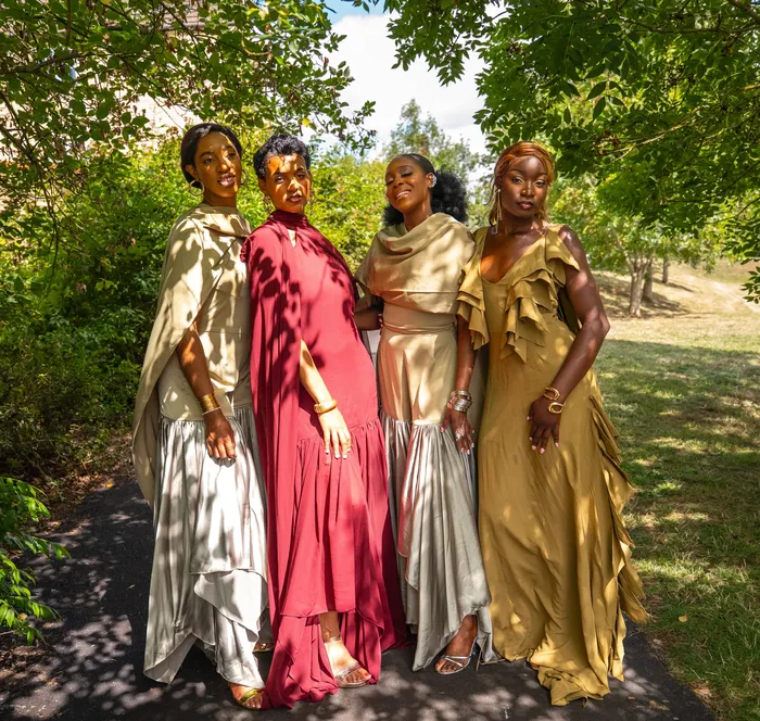 Group fashion shoot in satin gowns in a park, photographed by Imisi Bamiro, Coventry photographer