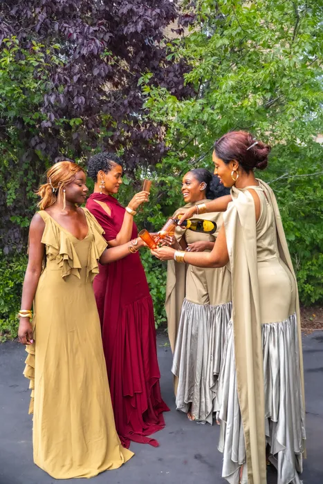Group fashion shoot in satin gowns in a park, photographed by Imisi Bamiro, Coventry photographer