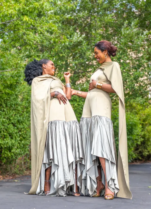 Group fashion shoot in satin gowns in a park, photographed by Imisi Bamiro, Coventry photographer