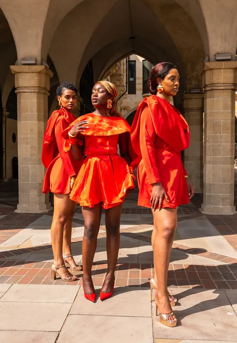 Three women in matching red dresses, fashion editorial, photographed by Imisi Bamiro, Coventry photographer