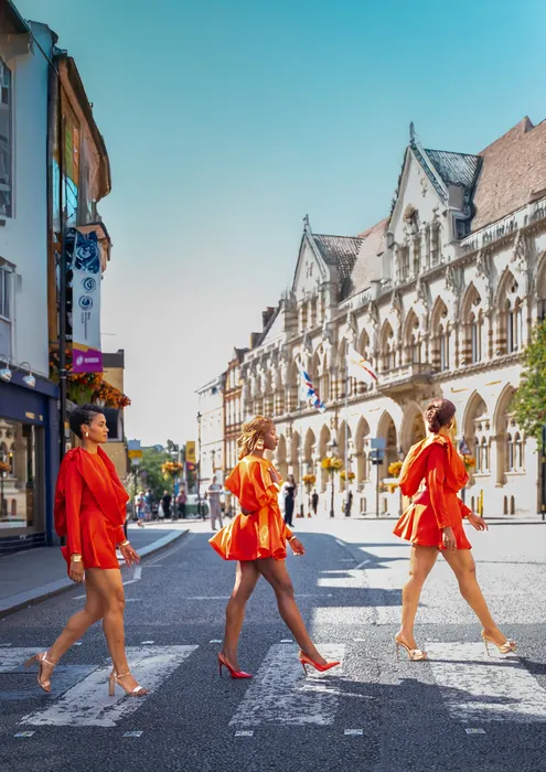 Three women in matching red dresses, fashion editorial, photographed by Imisi Bamiro, Coventry photographer