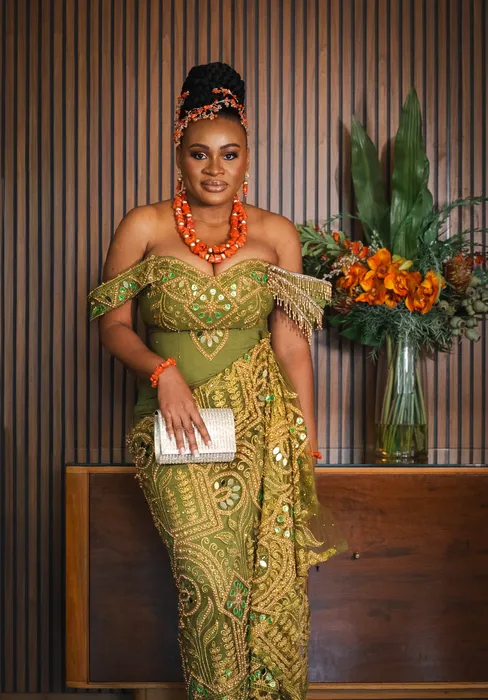 Traditional wedding portrait, couple in green and coral beads, photographed by Imisi Bamiro, Coventry photographer