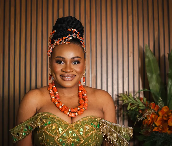 Traditional wedding portrait, couple in green and coral beads, photographed by Imisi Bamiro, Coventry photographer