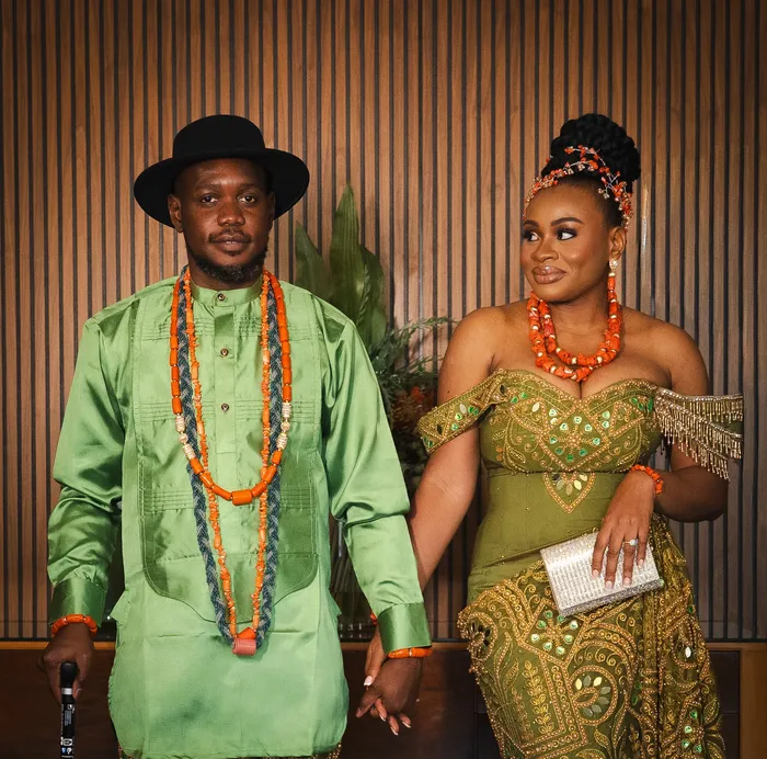 Traditional wedding portrait, couple in green and coral beads, photographed by Imisi Bamiro, Coventry photographer
